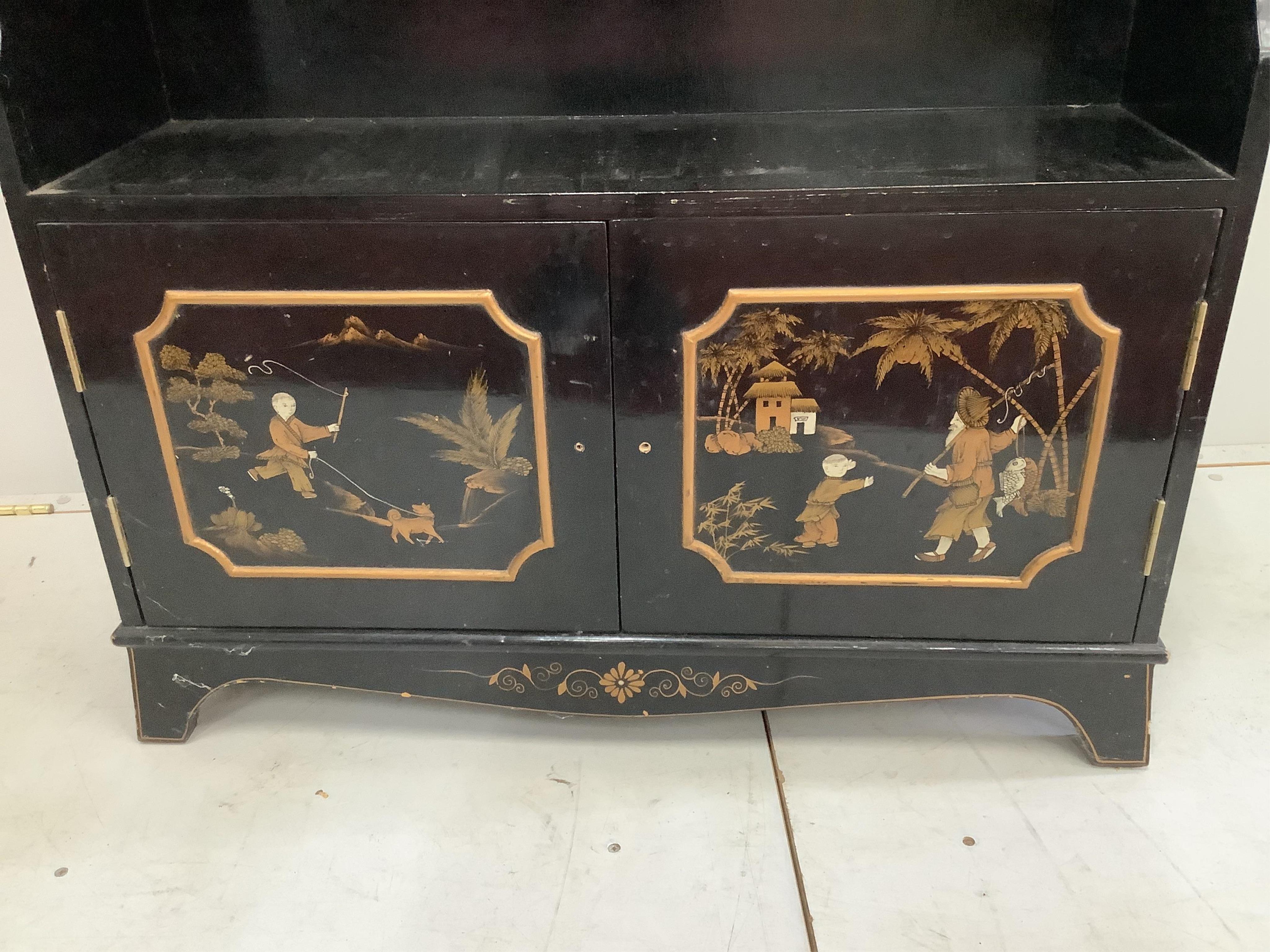 A reproduction chinoiserie decorated open dwarf bookcase, width 88cm, depth 26cm, height 120cm. Condition - fair